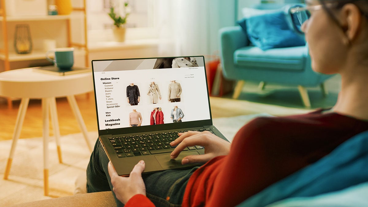 person on laptop doing online shopping as a digital mystery shopper