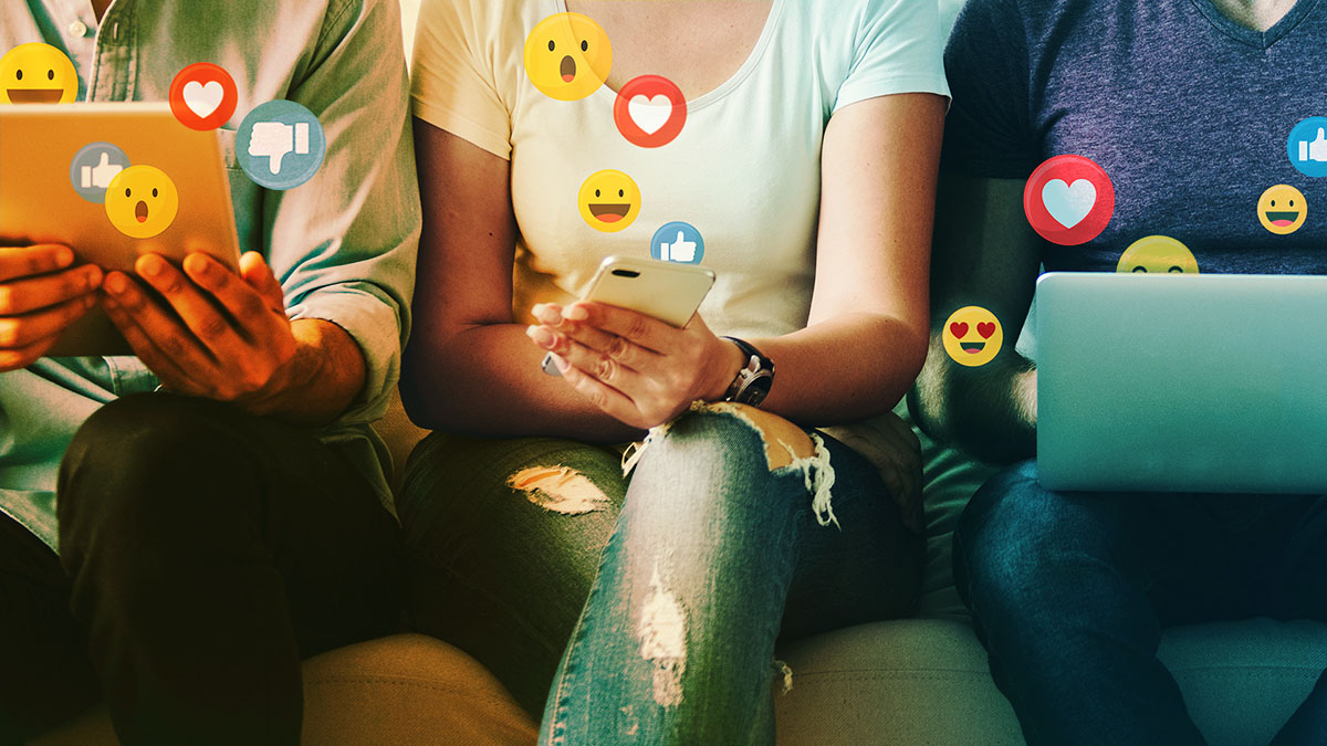 Group of people posting on social media on their devices