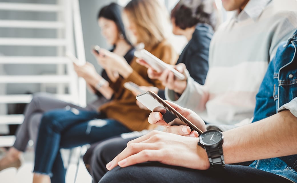 Group of people using smartphones