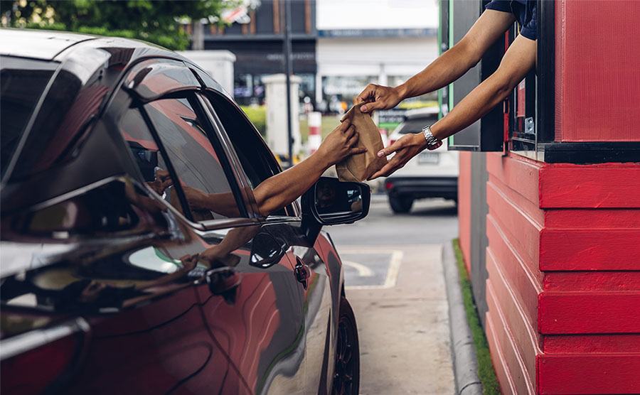 receiving order at a fast food drive thru